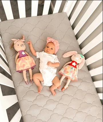 Parents choice baby care products including diapers and wipes laid out for a newborn nursery